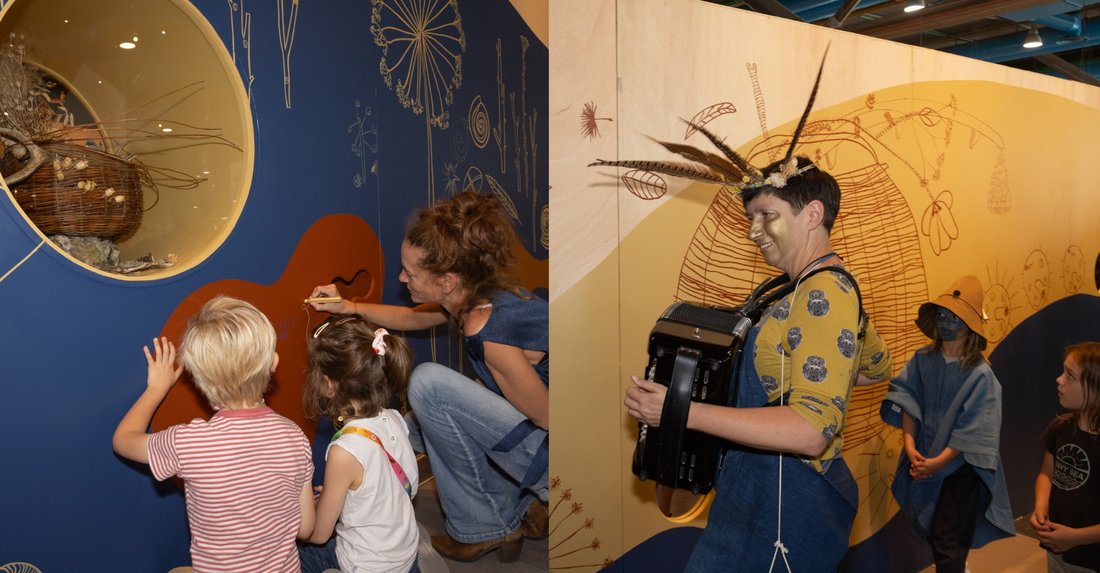 Enfants et adultes dessinant sur les cimaises de la galerie et animatrice jouant de l'accordéon